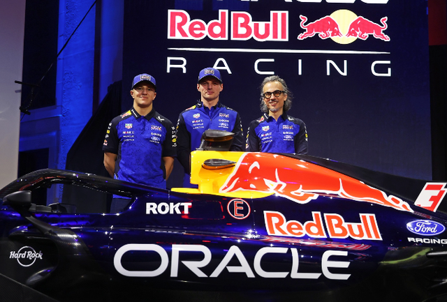 <p>Max Verstappen (centre) poses next to Red Bull's 2026 F1 livery in Detroit on Thursday</p>