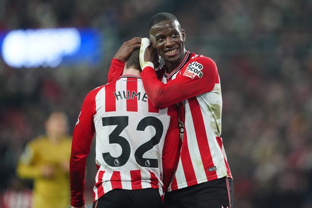 Sunderland’s Nordi Mukiele (right) and Trai Hume hug at the final whistle (Owen Humphreys/PA)