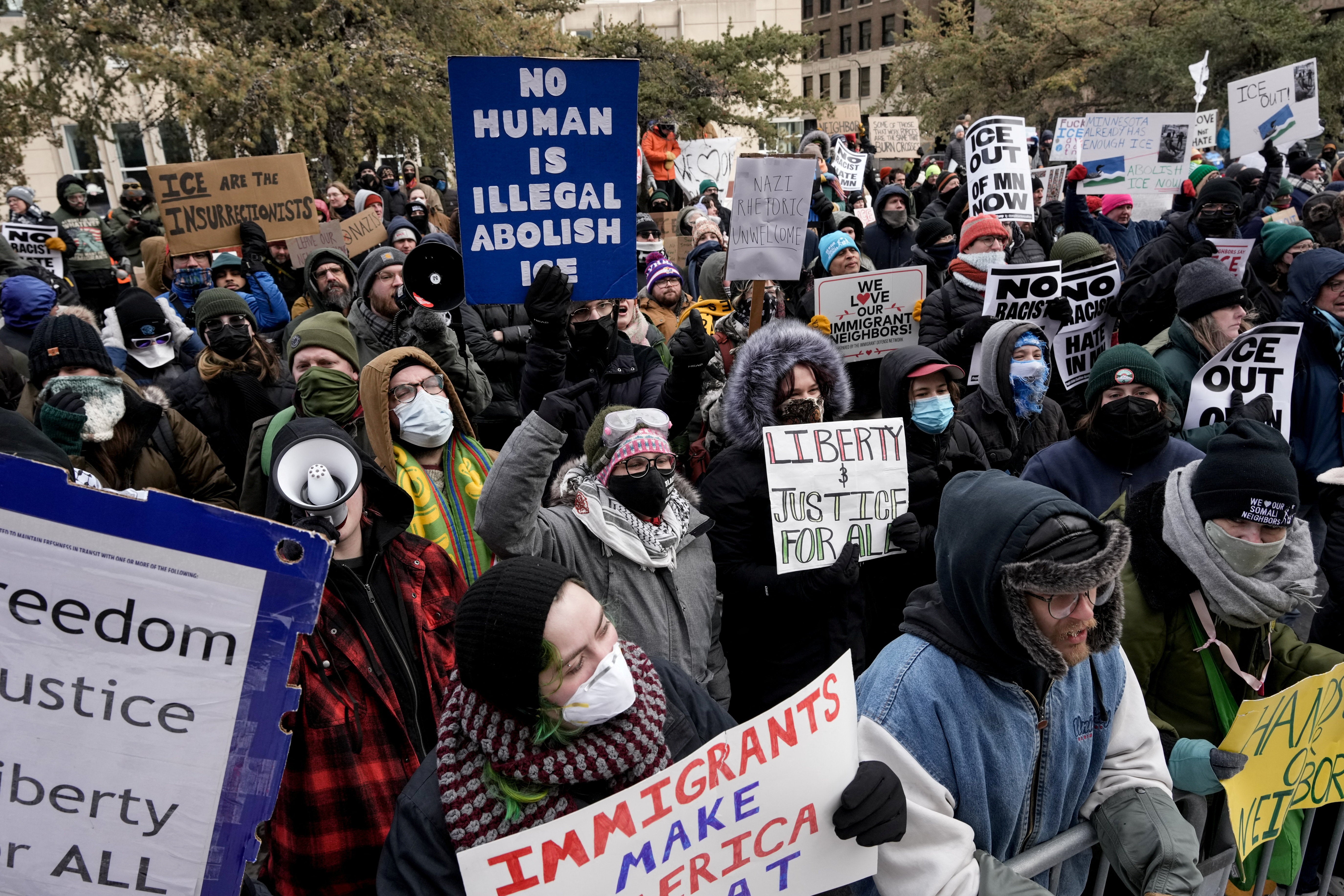 Counter-protesters rallied near Minneapolis City Hall after federal law enforcement surged into the city to support Trump’s mass deportation campaign