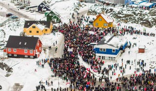 This aerial view taken by Mads Schmidt Rasmussen and handed out by Arctic Creative shows people as they take part in a demonstration that gathered almost a third of the city population to protest against the US President's plans to take Greenland
