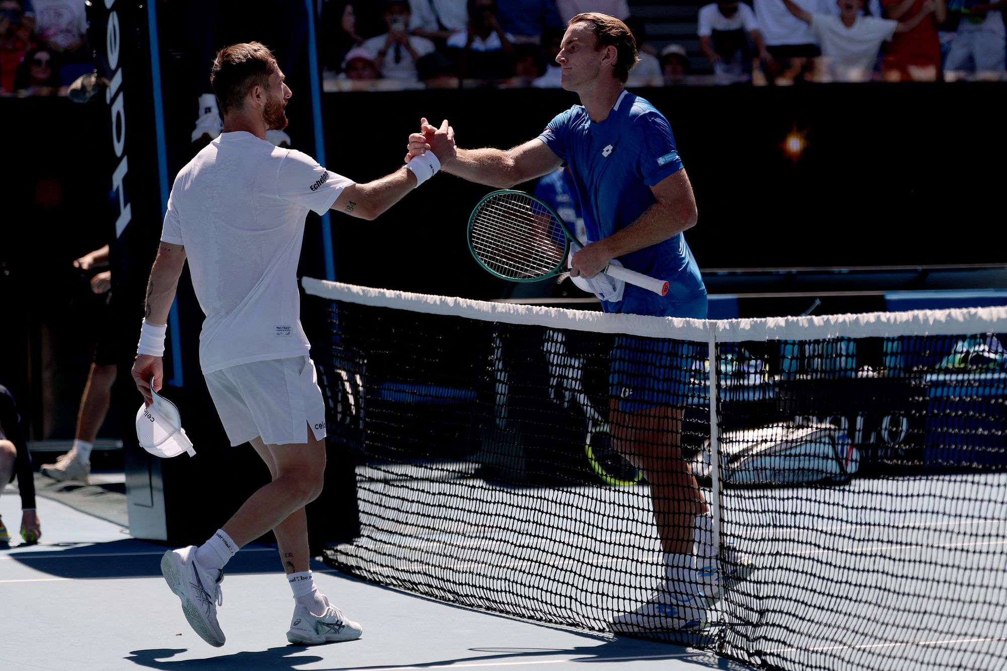 France's Corentin Moutet shakes hands with Australia's Tristan Schoolkate
