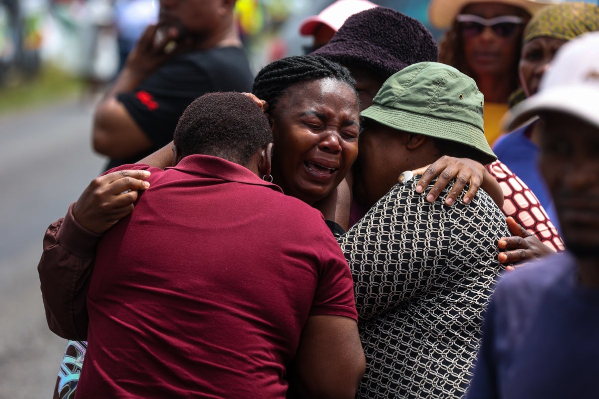South African authorities revise death toll in school bus crash to 12 as driver is arrested