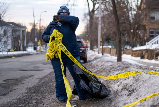 <p>A woman coughs while cleaning the streets after inhaling a chemical irritant in Minneapolis, Minnesota, earlier this month. Chemicals and other irritants can trigger asthma attacks. Now, researchers may have a method to help predict when they’ll occur</p>