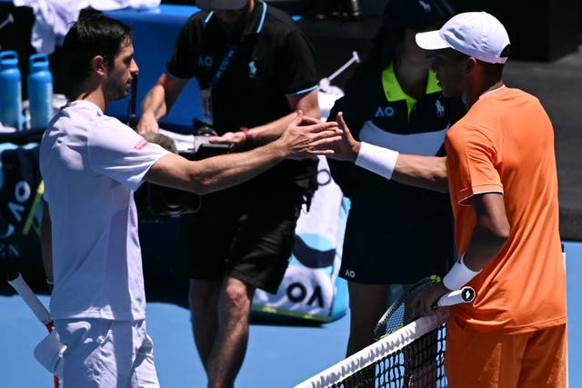 <p>Portugal's Nuno Borges is congratulated by Canada's Felix Auger-Aliassime, who retired from an injury</p>