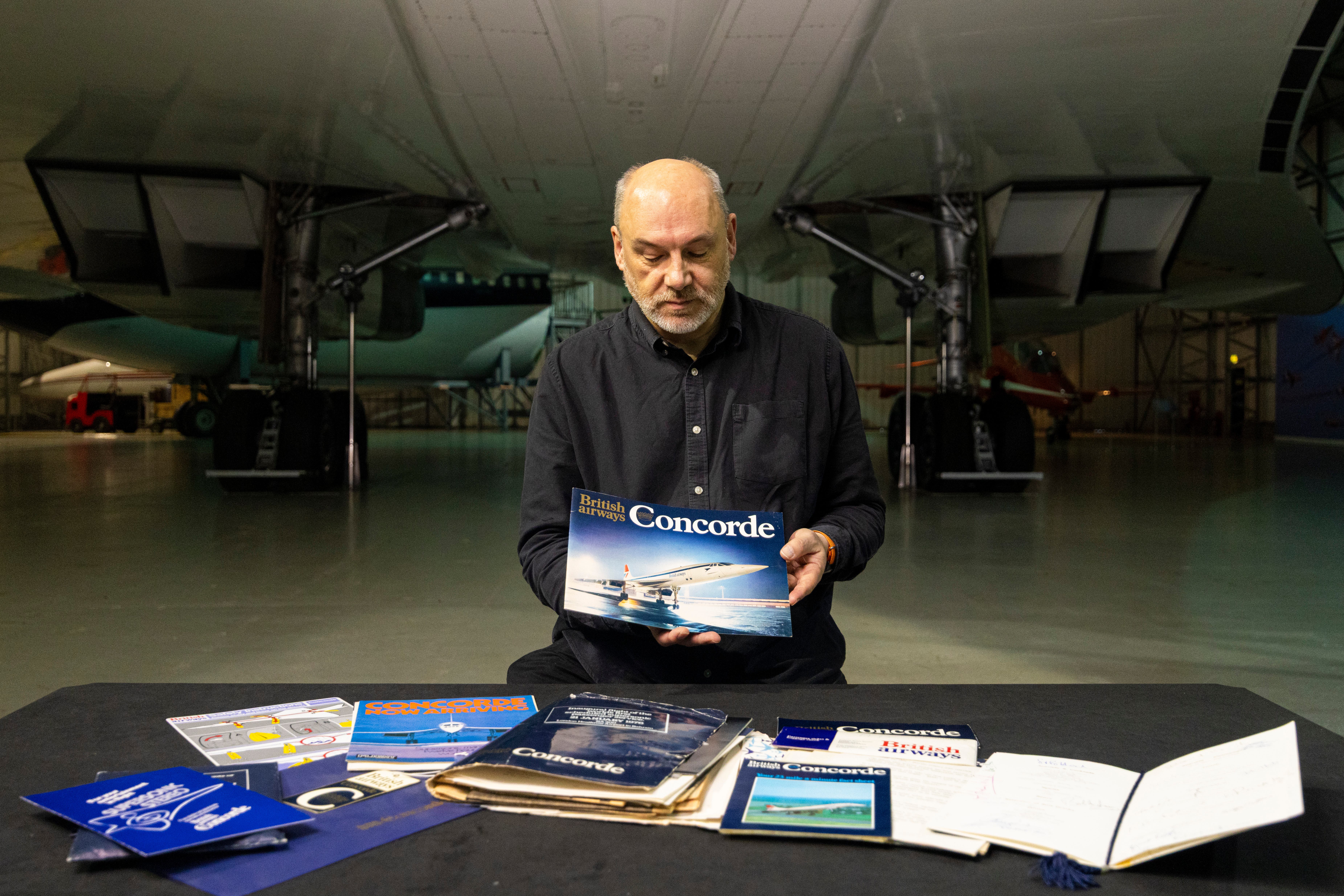 Curator Ian Brown under the wings of Concorde G-BOAA with the archive (Duncan McGlynn/PA)