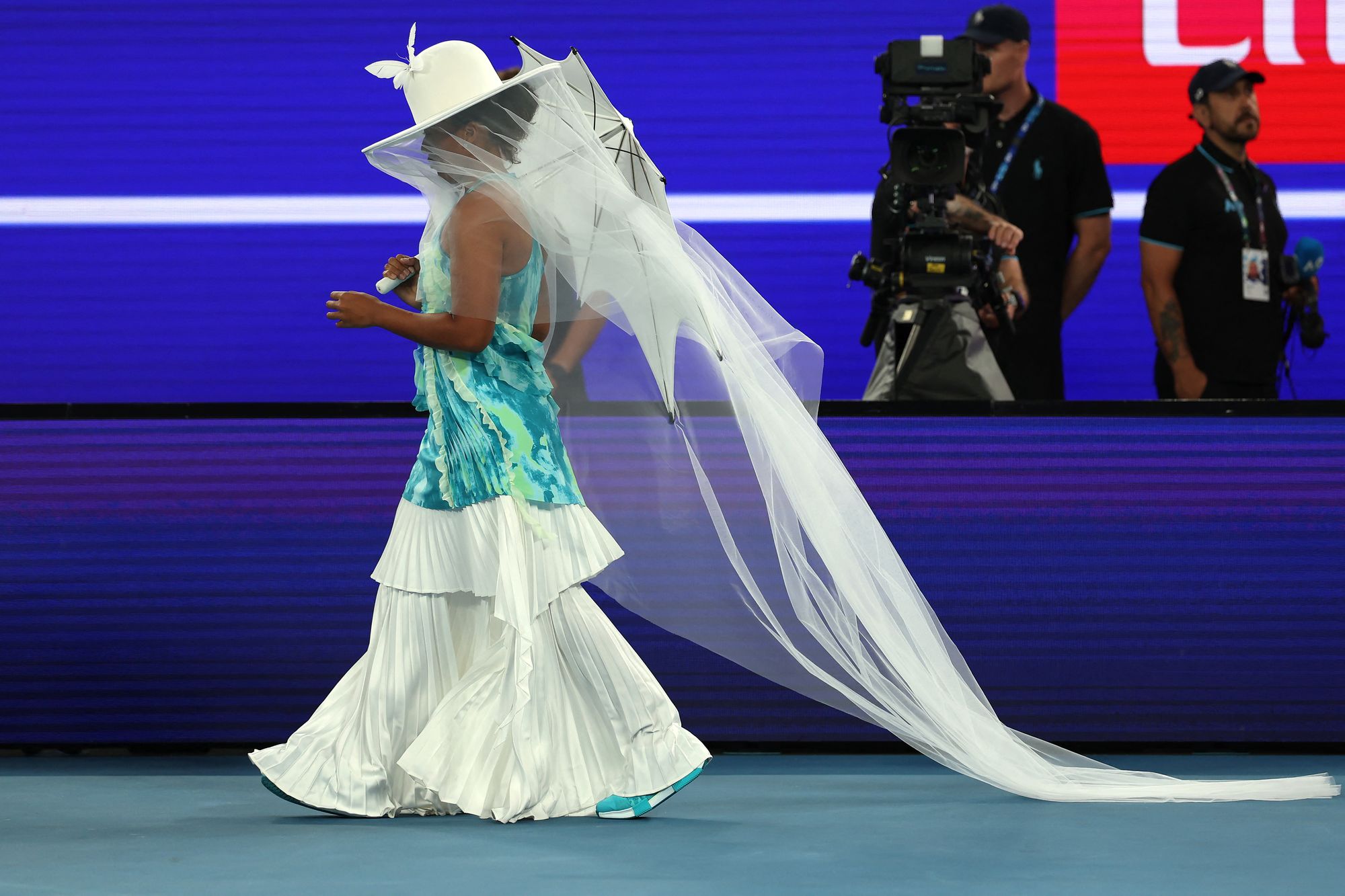 Osaka’s outfit meant she had to have her rackets carried onto the court