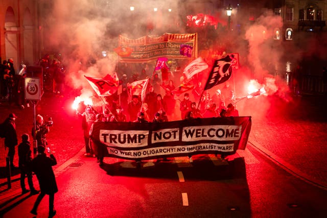 <p>Protesters hold a banner reading "Trump not welcome" during a rally against the World Economic Forum in Davos and the visit of US President Donald Trump, in Zurich, Switzerland, on Monday, Jan. 19, 2026. (Michael Buholzer/Keystone via AP)</p>