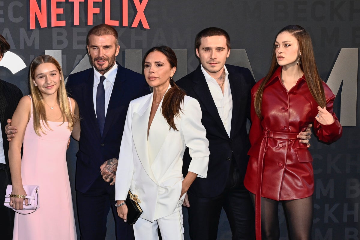 Grumpy looking Nicola Peltz pulled into posing for Beckham family photo in resurfaced video