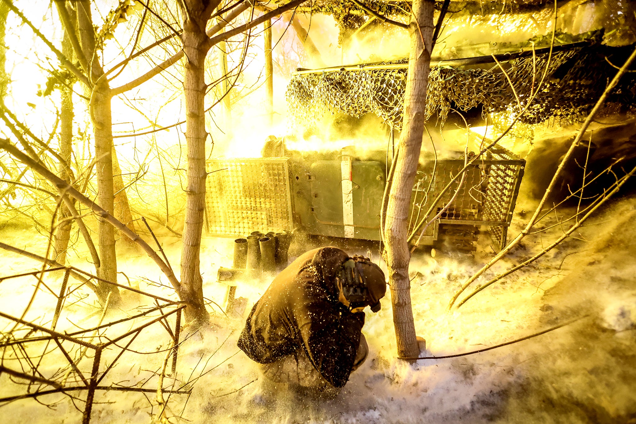 A Ukrainian artilleryman fires 122mm howitzer towards Russian positions near Chasiv Yar