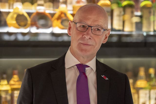 First Minister John Swinney is being urged to ‘reach out’ to Donald Trump amid concerns over the impact a threatened hike in tariffs would have on the Scotch whisky industry (Jane Barlow/PA)