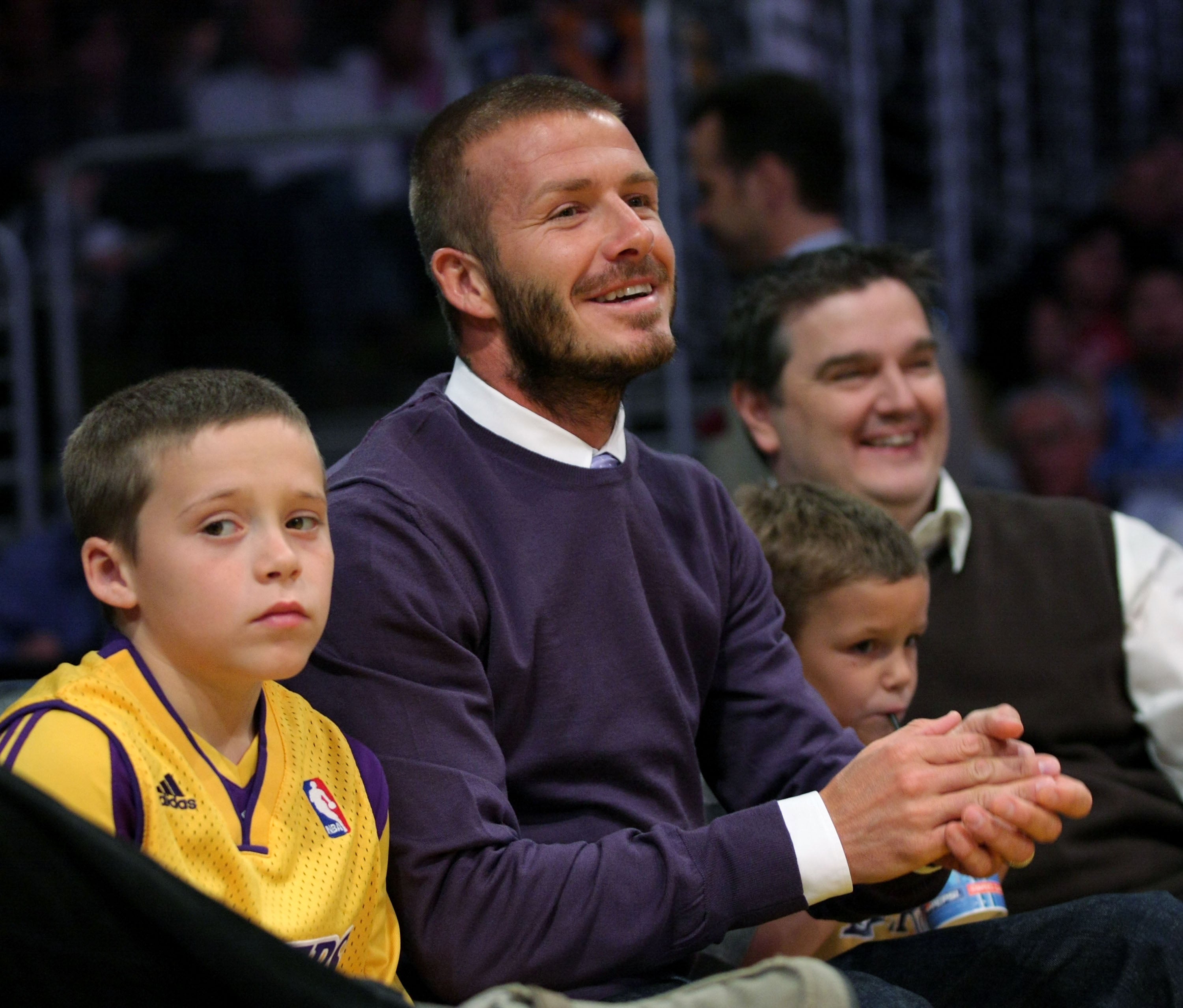 <p>Brooklyn Beckham (pictured left aged 9, with father David and brother Romeo) complained that ‘inauthentic relationships have been a fixture of the life I was born into’</p>