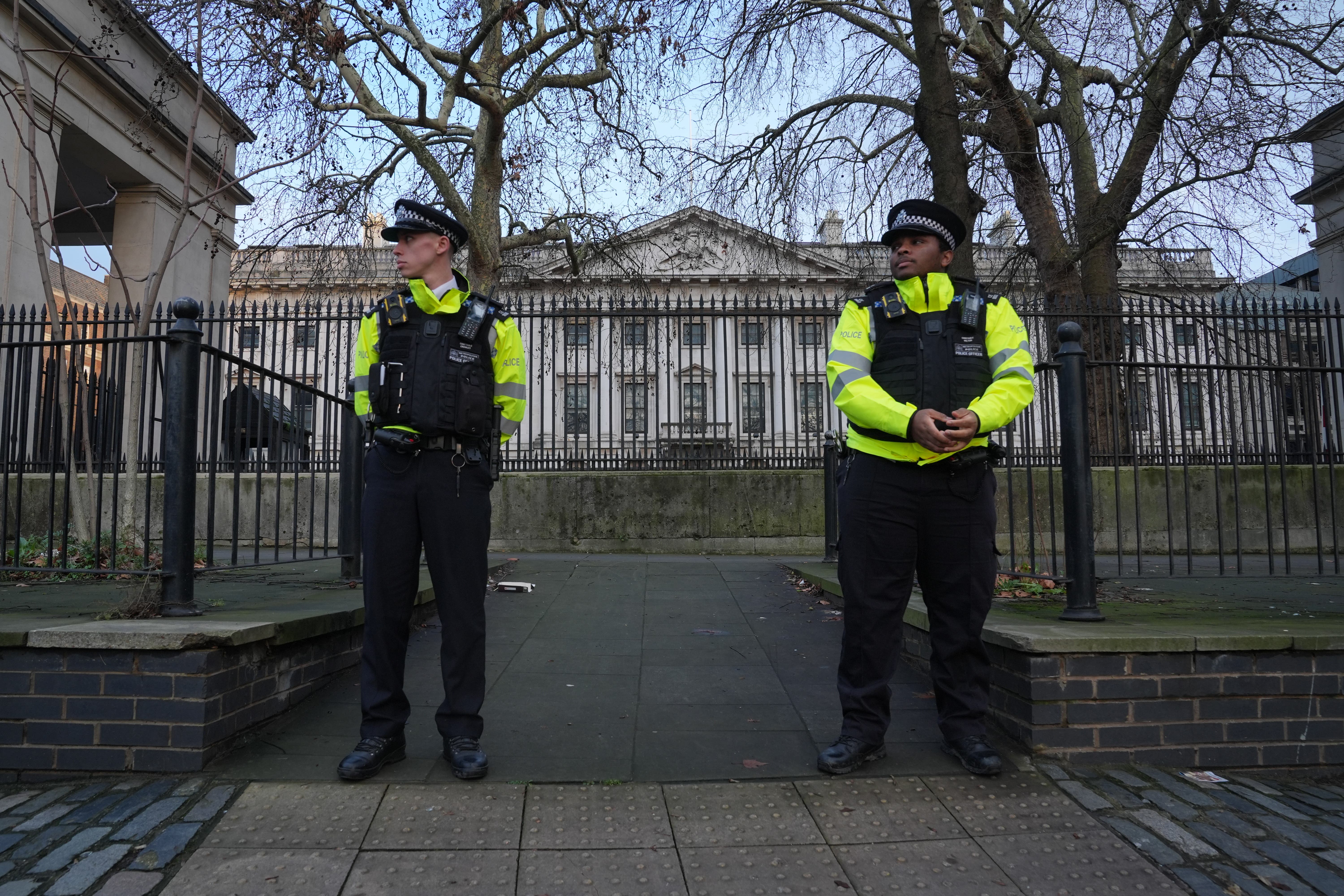<p>Police officers outside Royal Mint Court, London, where China wants to build its new embassy </p>