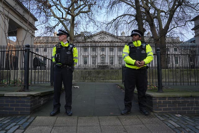 <p>Police officers outside Royal Mint Court, London, where China wants to build its new embassy </p>