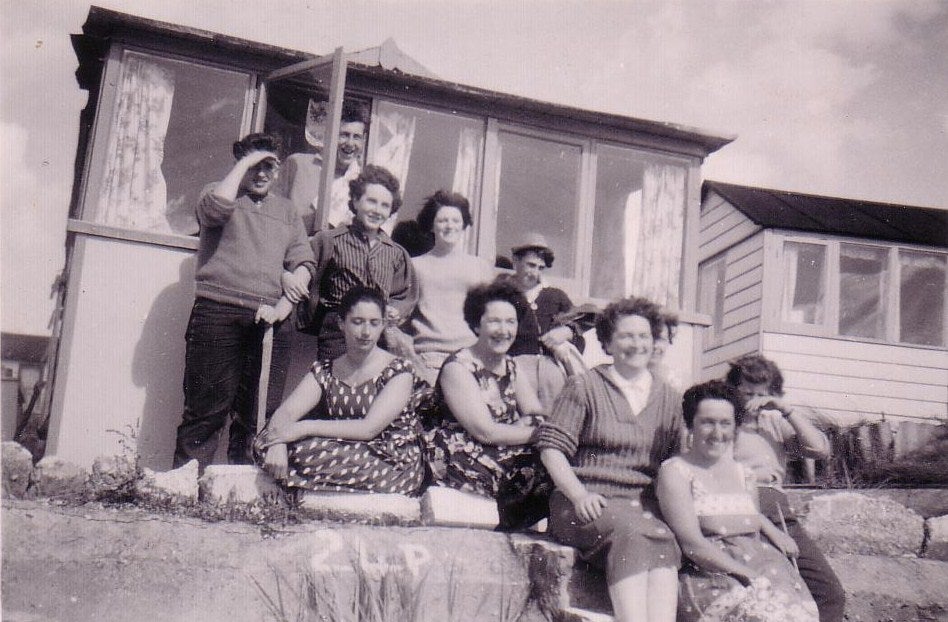A picture from the 1950s showing Hayley Reynolds' family and friends at a beach hut rented before her mother was able to buy one in the 1980s