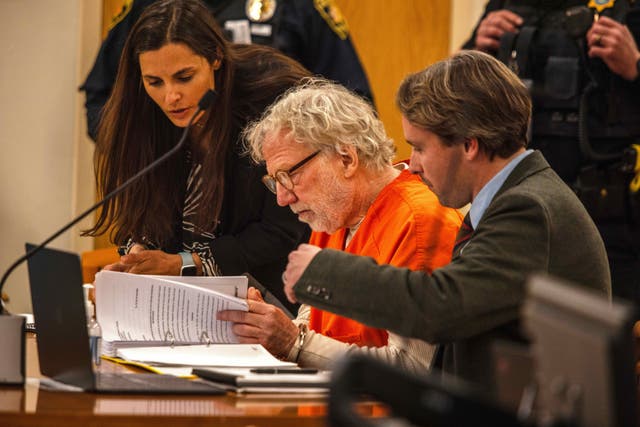<p>Director and actor Timothy Busfield reviews papers in court</p>