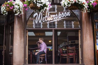Pub group JD Wetherspoon has warned over a hit to profits as it revealed costs surged by £45 million in its first half