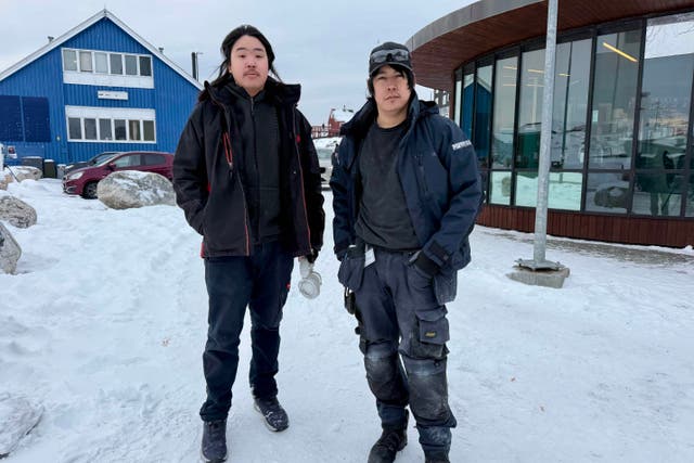 <p>Nuuk residents Elias Larson and Erik Christensen say they are anxious for Greenland to avoid conflict</p>