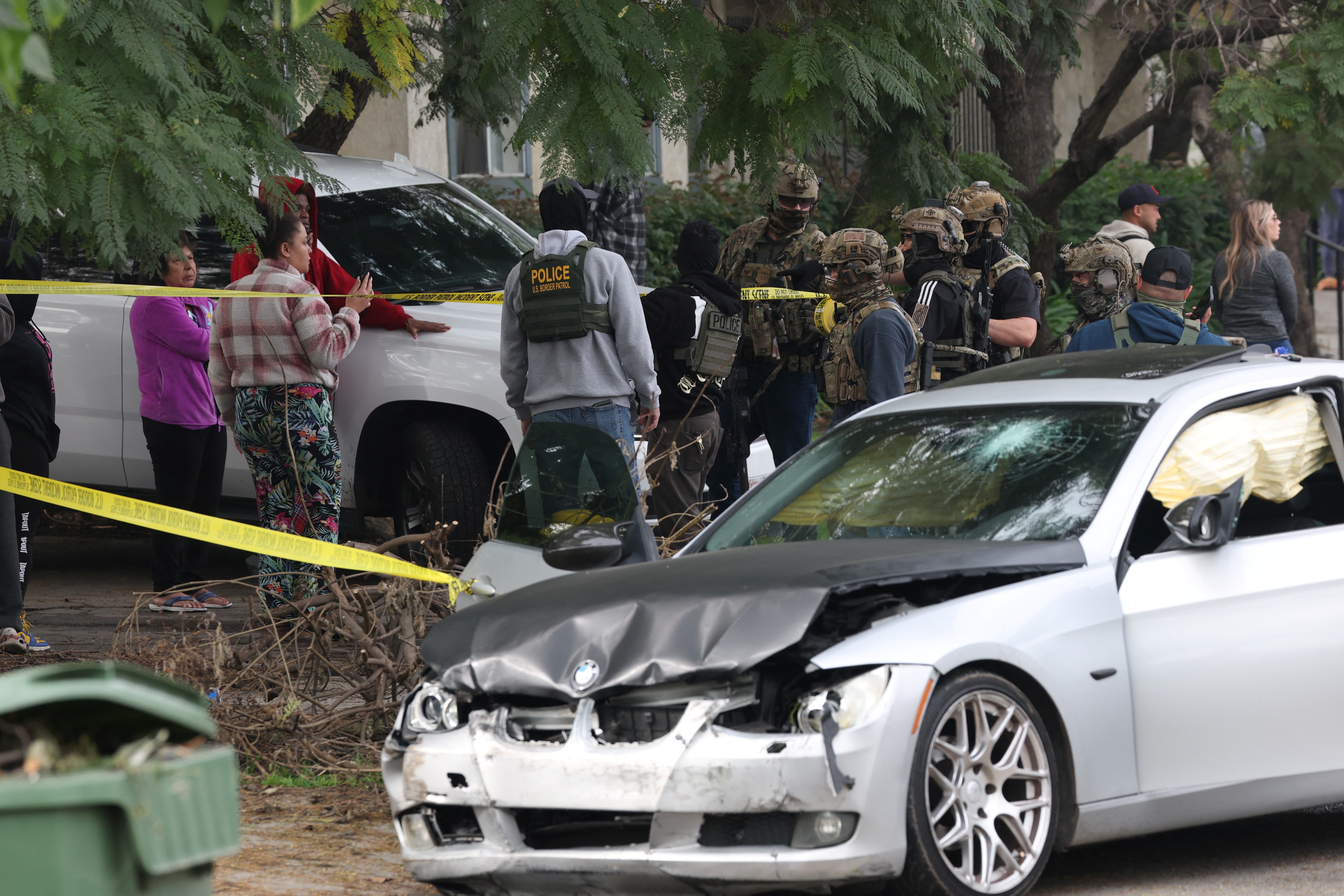 <p>A federal officer opened fire on a man near a school in South Los Angeles after he rammed agents with a car during an immigration operation, the Department of Homeland Security has said</p>