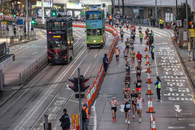 <p>Runners take part in the half marathon race during the Hong Kong Marathon in Hong Kong on January 18, 2026</p>