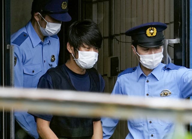 <p>File: Tetsuya Yamagami, convicted of killing former Japanese premier Shinzo Abe, is escorted by police officers as he is taken to prosecutors, at Nara-nishi police station in Nara, western Japan, in this photo taken by Kyodo, 10 July 2022</p>