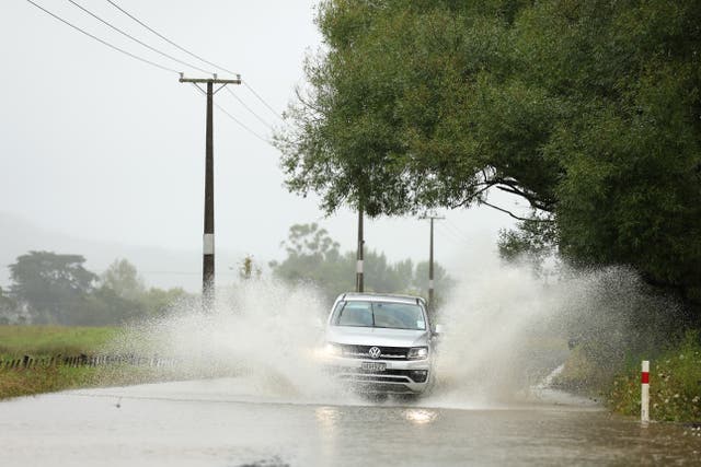 <p>A car drives through flooding in Kaipara Flats on January 21, 2026 in Auckland, New Zealand</p>