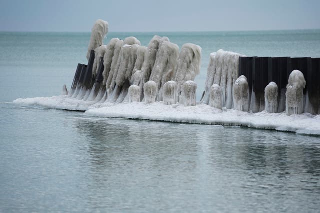 <p>Ice forms on a pier along Lake Michigan ona. cold Wednesday, Jan. 21, 2026, in Chicago. (AP Photo/Erin Hooley)</p>