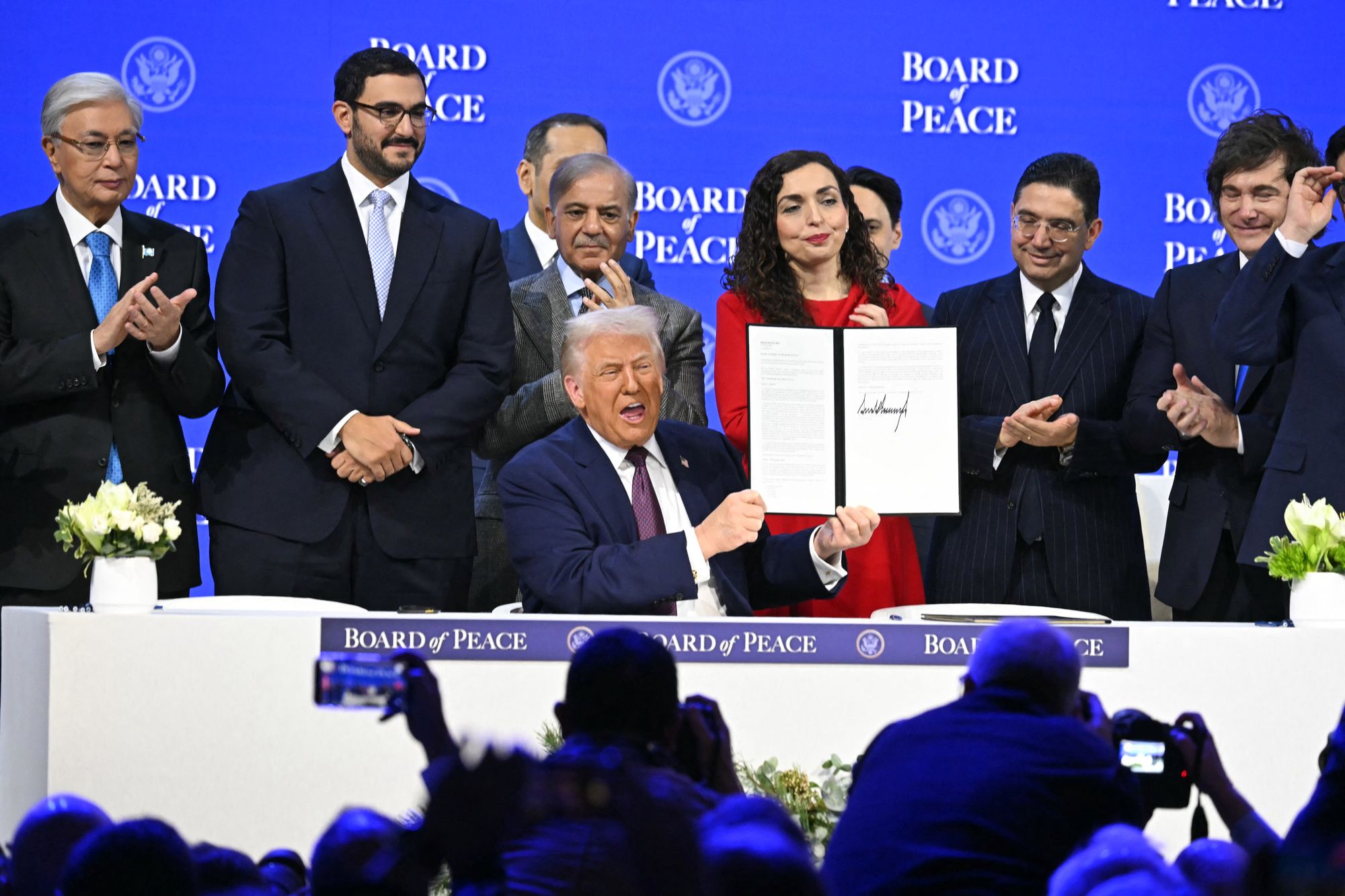 <p>US President Donald Trump holds a signing founding charter at the ‘Board of Peace’ meeting during the World Economic Forum (WEF) annual meeting in Davos</p>
