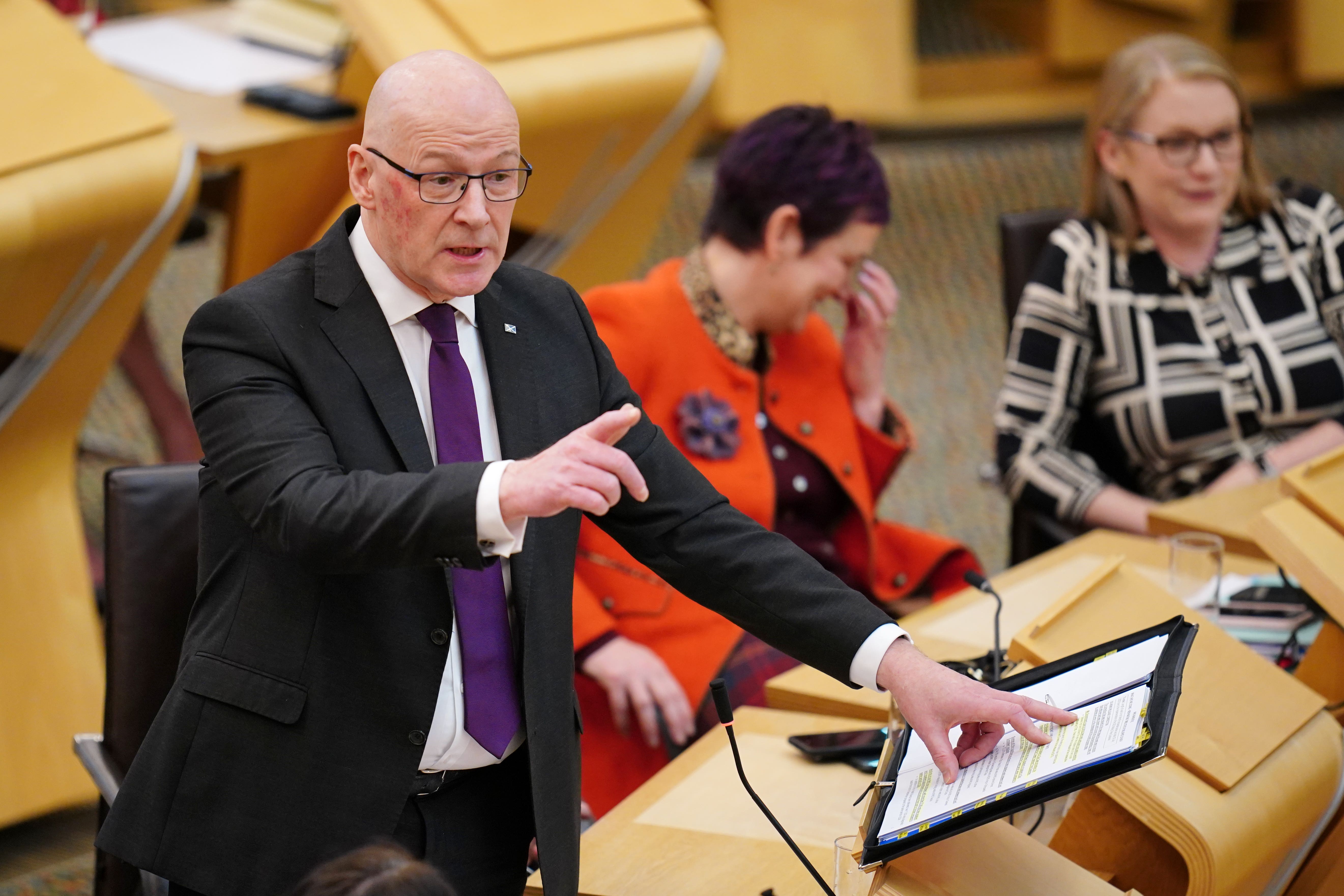 John Swinney responded to the accusations at First Minister’s Questions (Jane Barlow/PA)