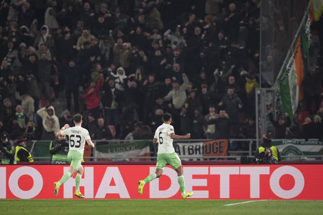 Auston Trusty, right, celebrates his goal in front of the Celtic fans (Massimo Paolone/LaPresse via AP)