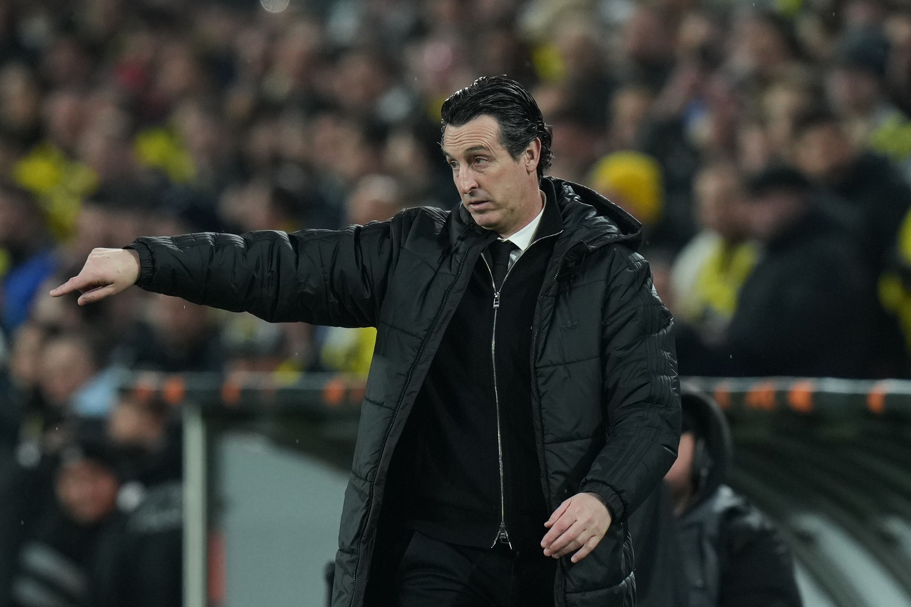 Unai Emery was happy his side prevailed in tough circumstances (Francisco Seco/AP)