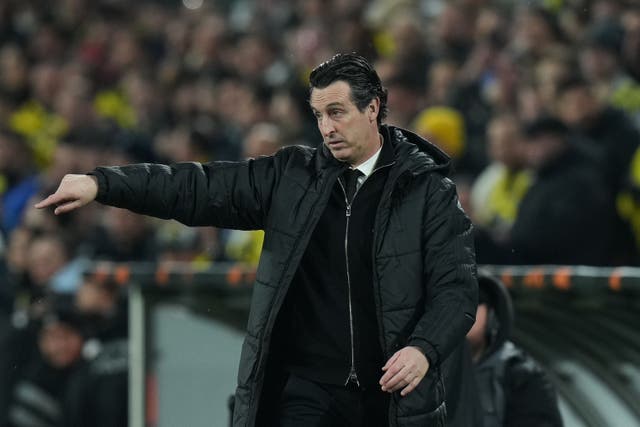 Unai Emery was happy his side prevailed in tough circumstances (Francisco Seco/AP)