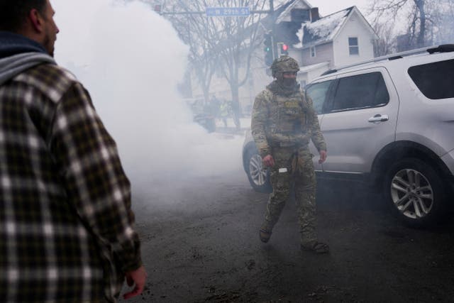 <p>A federal agent walks surrounded by tear gas used to deter protesters, as immigration enforcement continues after a U.S. Immigration and Customs Enforcement (ICE) agent fatally shot Renee Nicole Good on January 7 during an immigration raid, in Minneapolis, Minnesota, U.S., January 21, 2026</p>