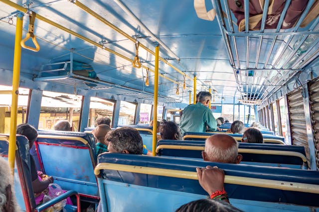 <p>File image: People inside a local Indian bus riding on the highway</p>
