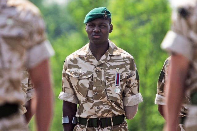 <p>Ben McBean stands during the parade at the 40 Commando Royal Marines</p>