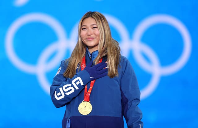 <p>Chloe Kim of Team United States celebrates during the Women's Snowboard Halfpipe medal ceremony on Day 6 of the Beijing 2022 Winter Olympic Games</p>