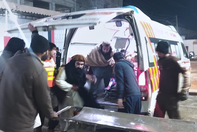 <p>Rescue workers attend to the victims of a suicide bombing  at a hospital in Dera Ismail Khan, Pakistan, on 23 January 2026</p>
