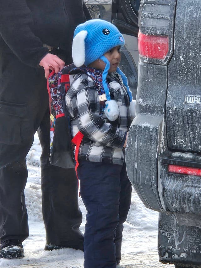 <p>An ICE agent holding onto the backpack of a five-year-old student at Valley View Elementary, Liam Conejo Ramos</p>