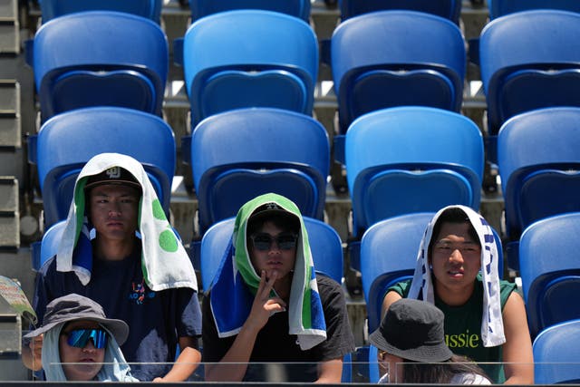 <p>Fans try to deal with extreme heat at the Australian Open</p>