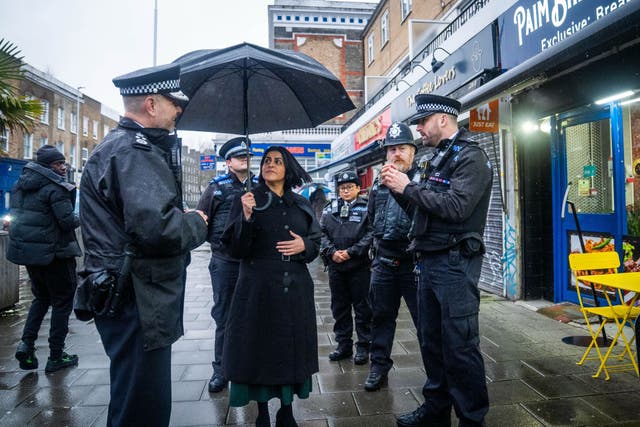 <p>Home Secretary Shabana Mahmood speaks with police officers during a walkabout in Lambeth, south London. </p>