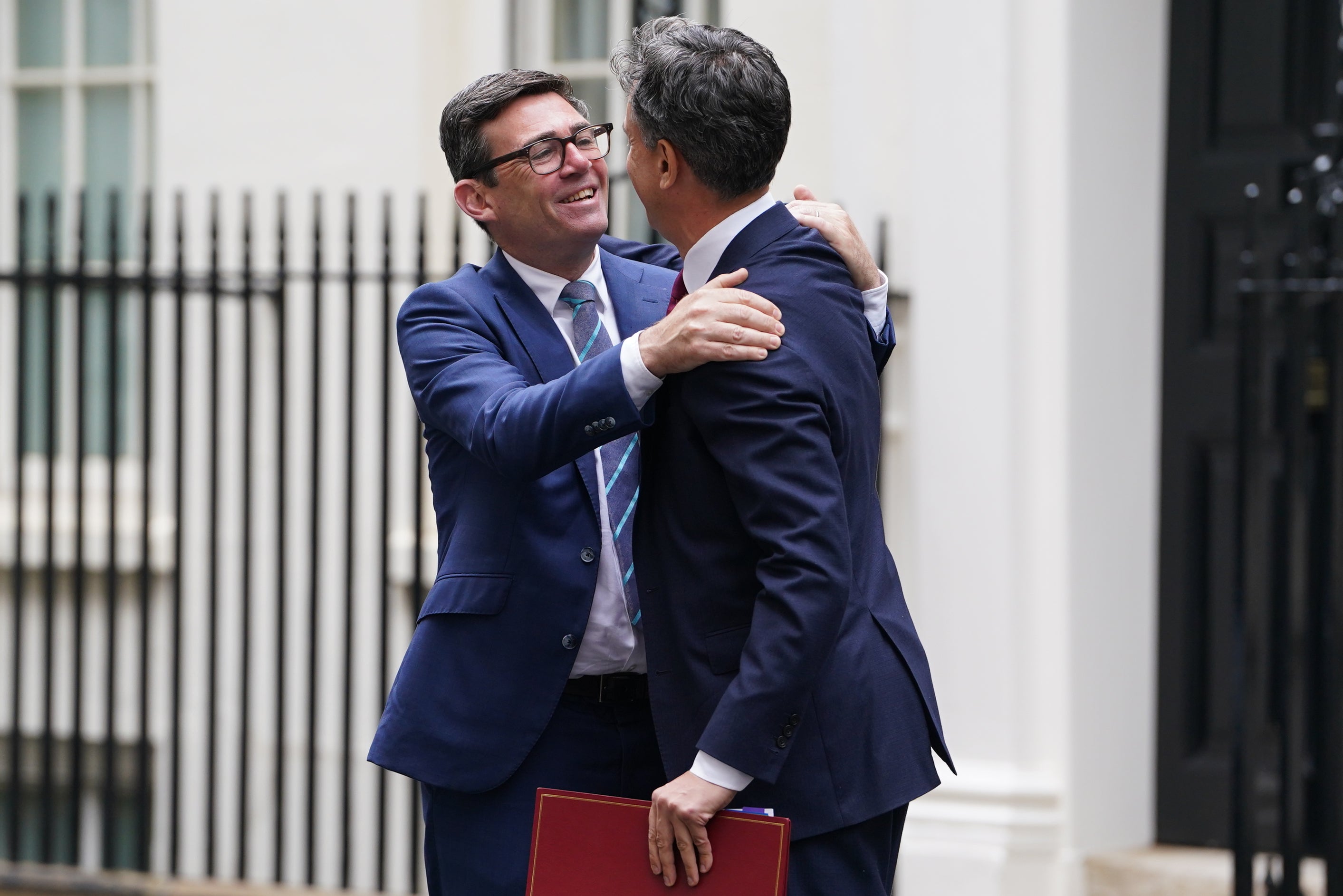 Andy Burnham pictured with energy secretary Ed Miliband