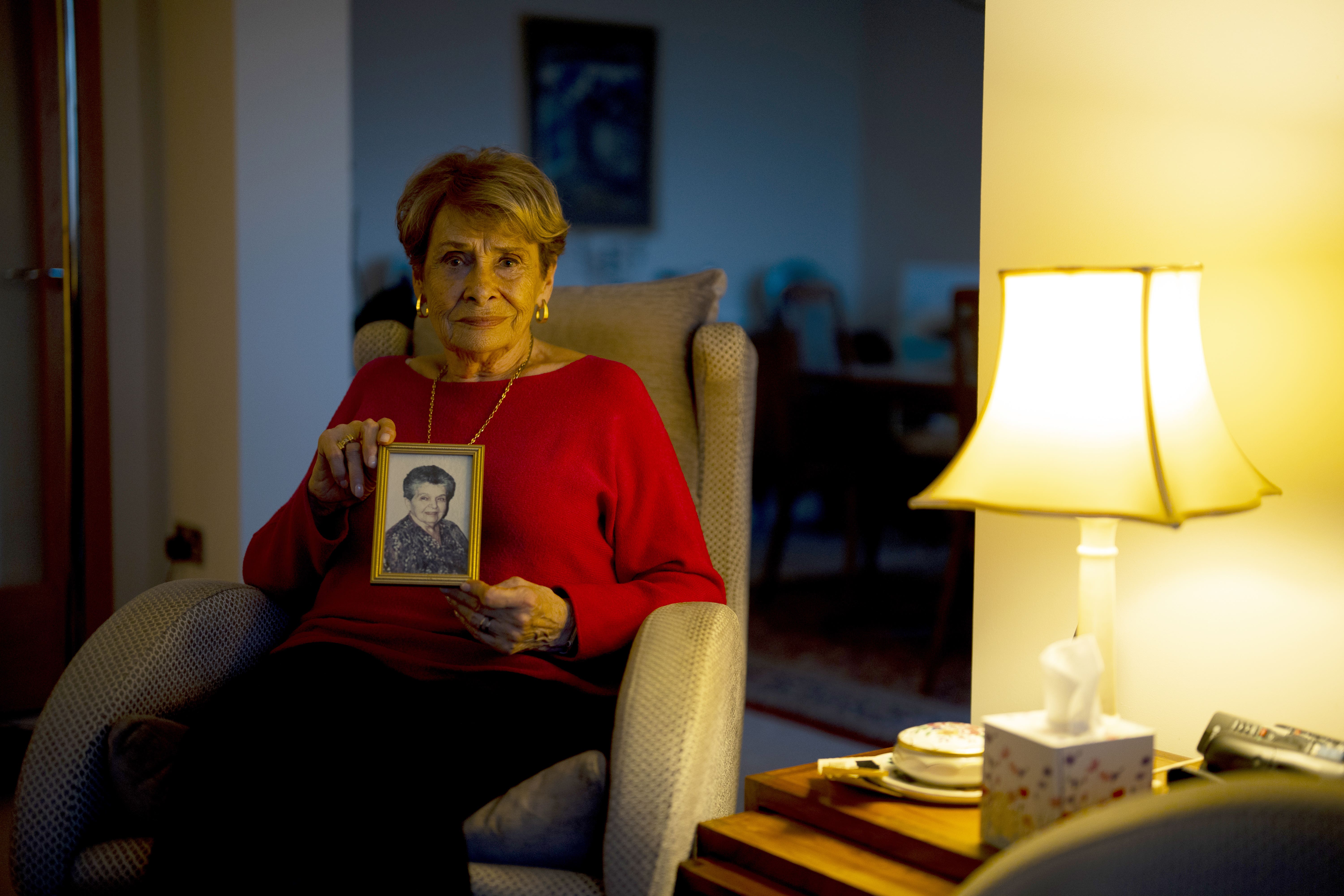 Holocaust survivor Annick Lever presents a photograph of her guardian ‘Mimi’ Andree Castex at her London home during an interview with the Press Association ahead of Holocaust Memorial Day