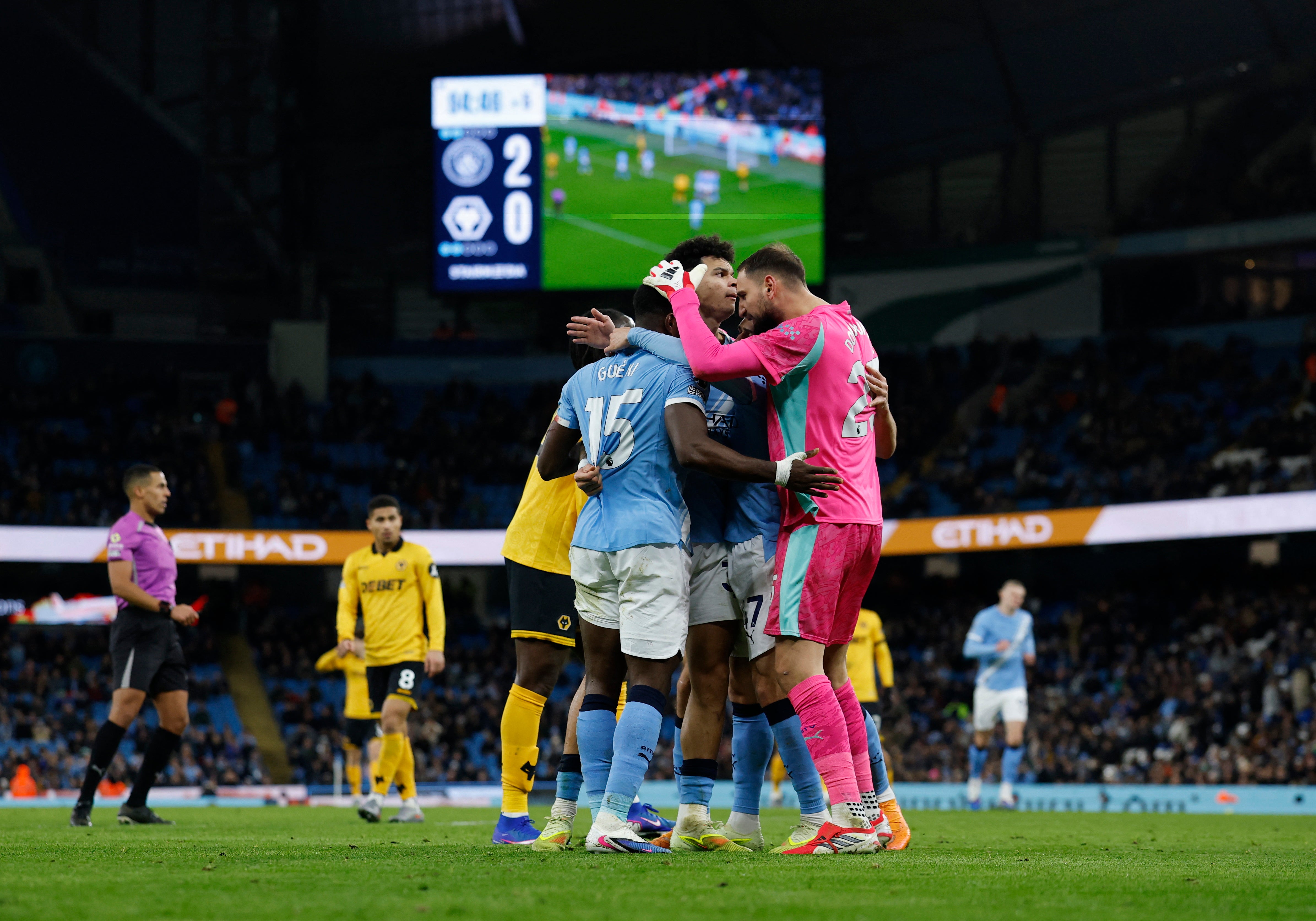 Marc Guehi is embraced by new teammates Gianluigi Donnarumma and Nico O'Reilly after Manchester City's victory over Wolves