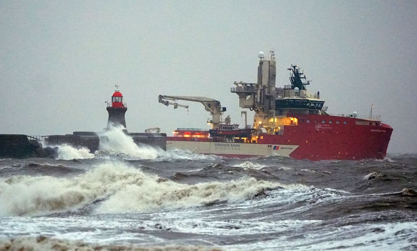 The Dogger Bank wind farm vessel passes the damaged South Shields sea wall and pier during Storm Ingrid