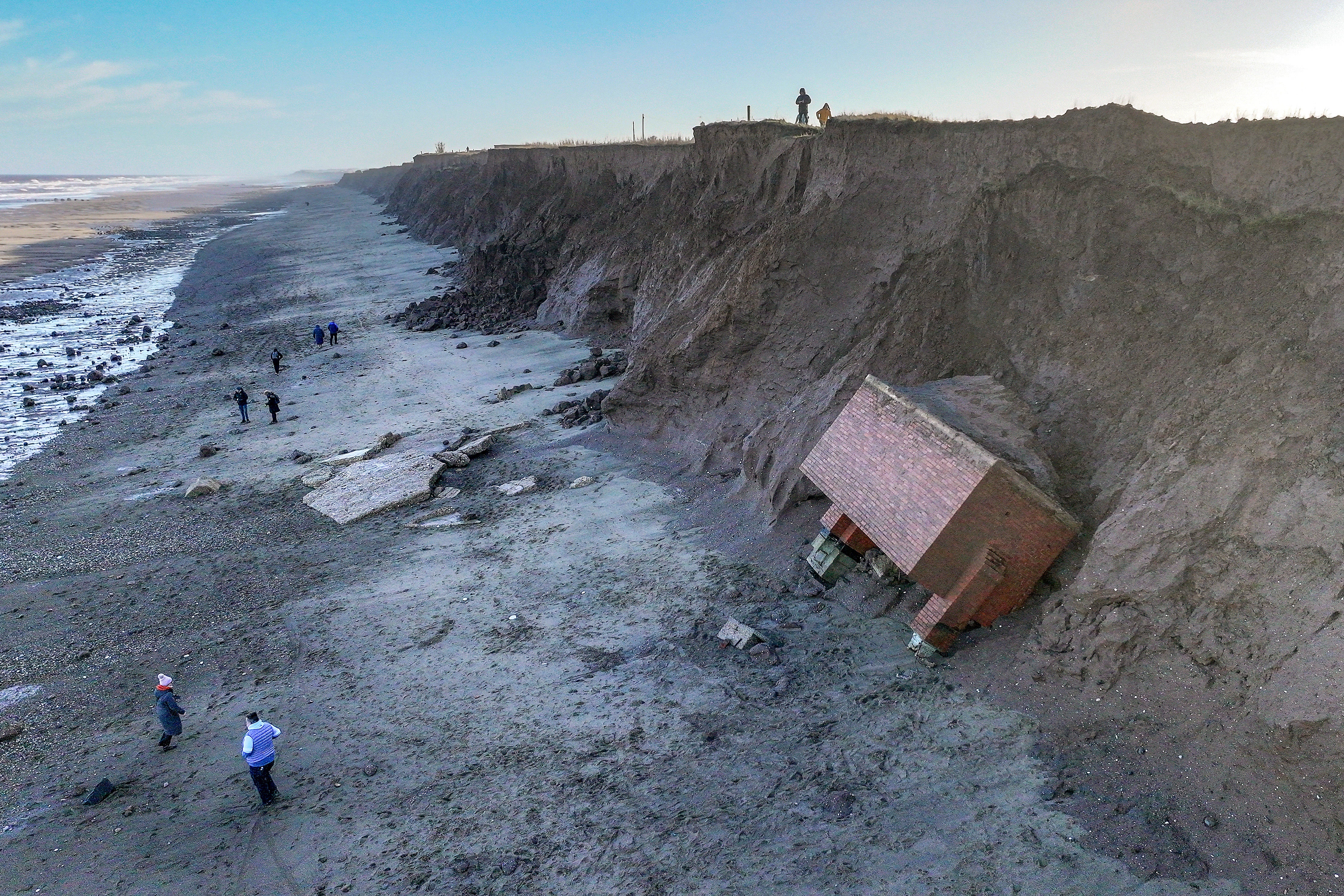 A decommissioned cold war nuclear observation post fell on to the beach after clinging perilously to the cliff face for the last month in Tunstall
