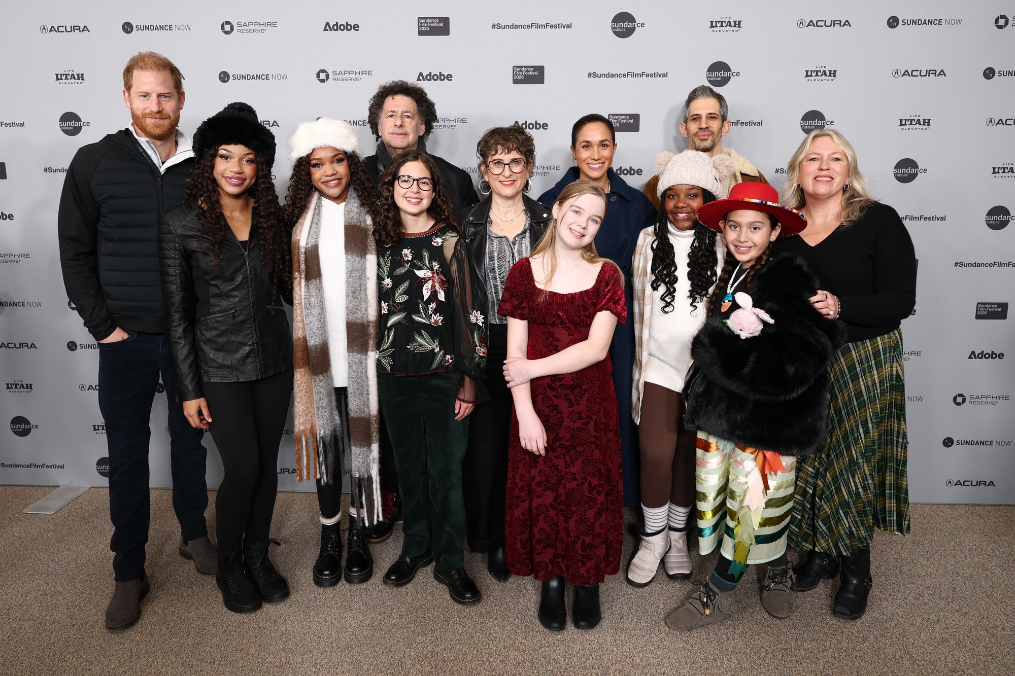 Prince Harry and Meghan Markle pose with the cast and crew at the ‘Cookie Queens’ premiere during the 2026 Sundance Film Festival