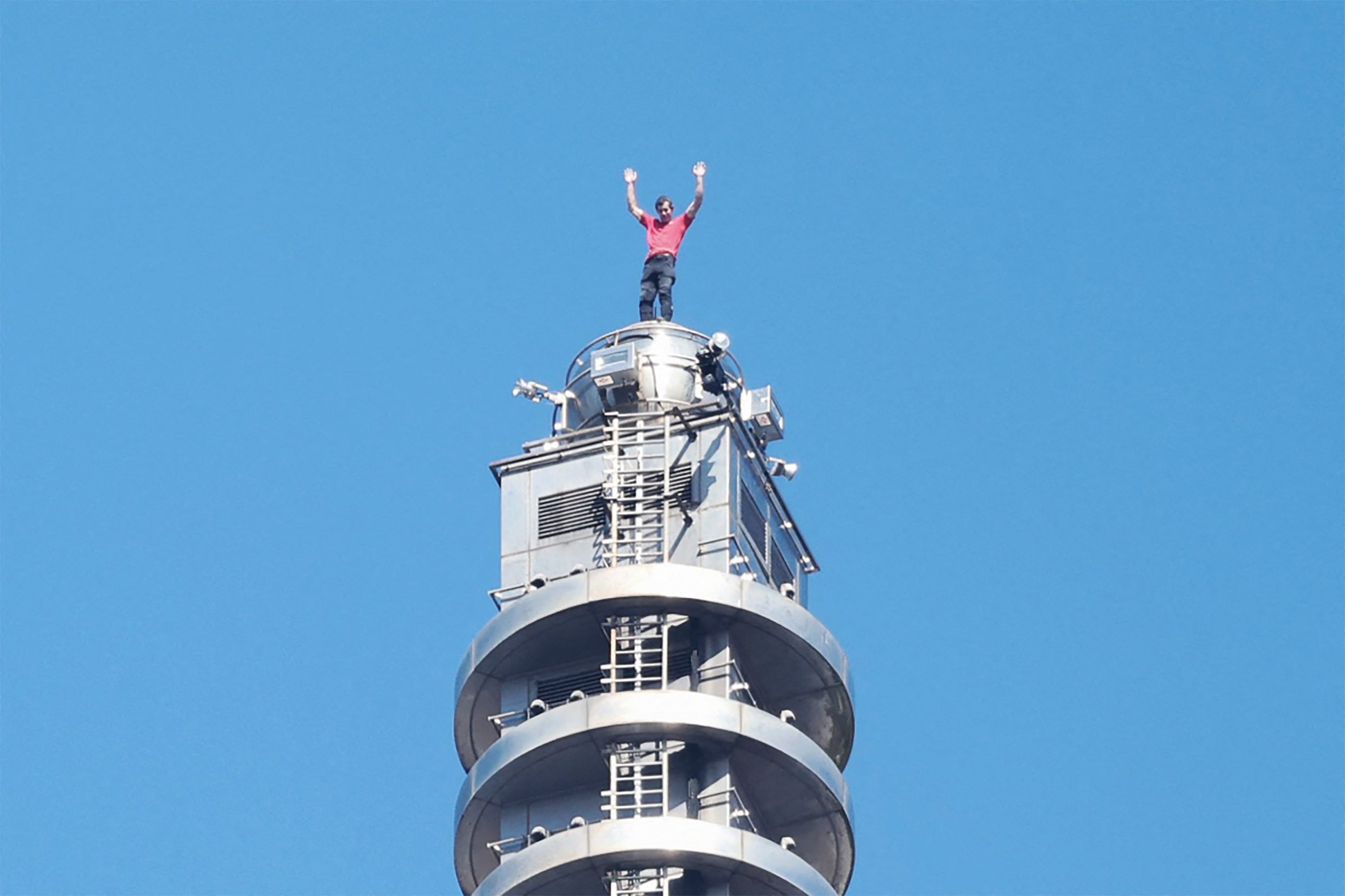 <p>US rock climber Alex Honnold raises his arms from the top of the Taipei 101 building after he successfully free soloed the landmark skyscraper without ropes or safety gear in Taipei on January 25, 2026</p>