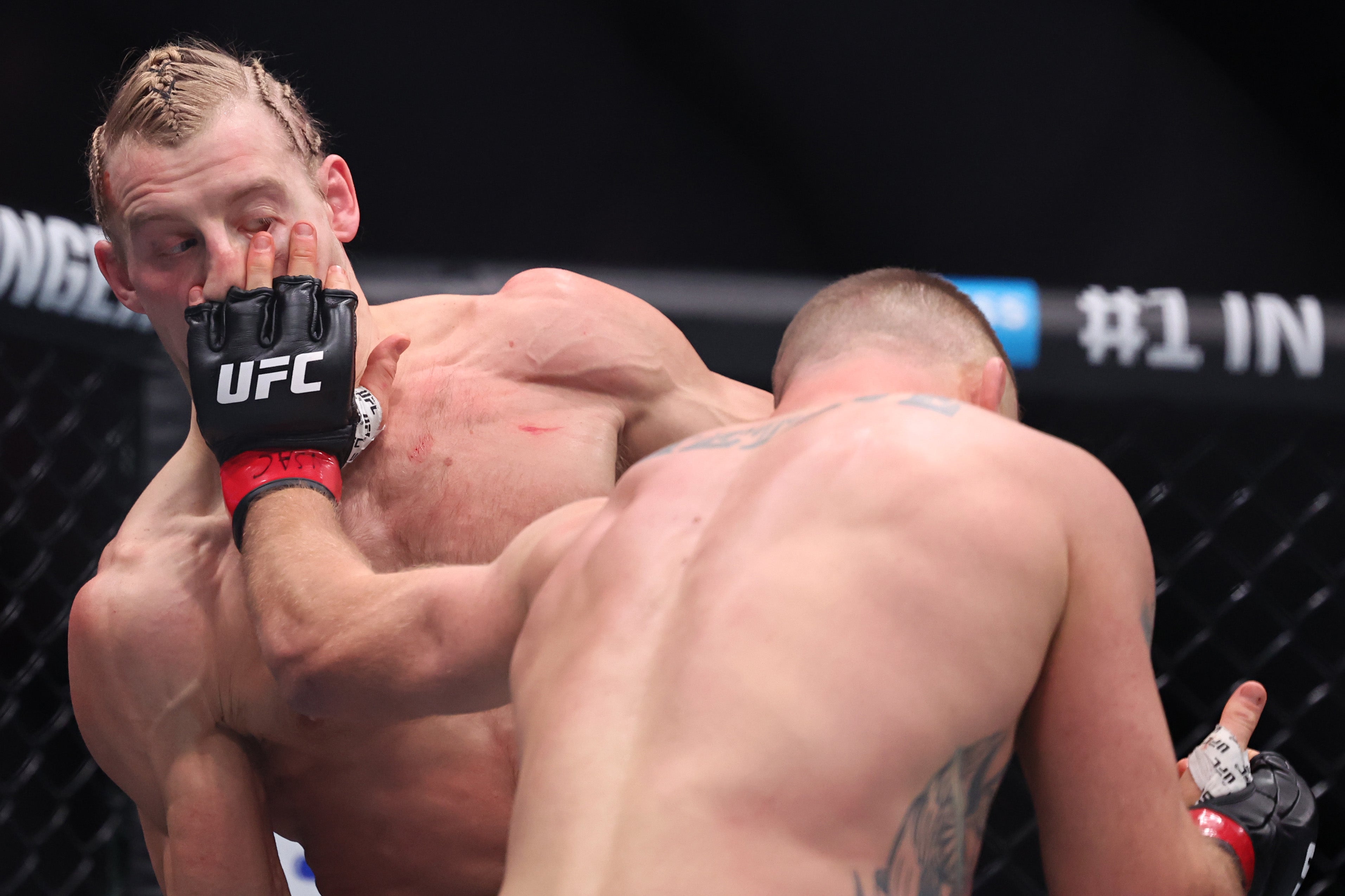 Paddy Pimblett (left) was caught with two eye pokes from Justin Gaethje