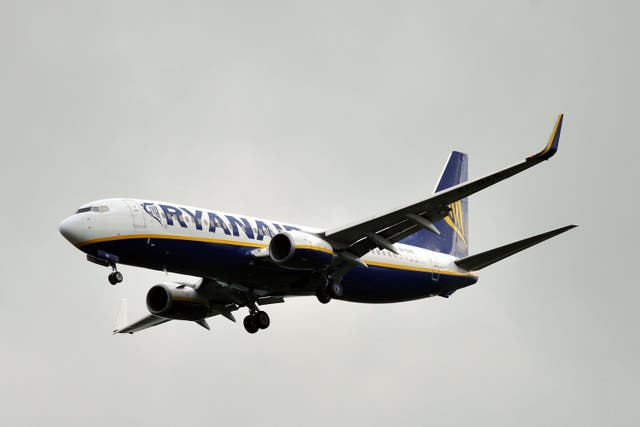 Ryanair has upped its annual outlook for passenger growth (Nicholas.T.Ansell/PA)