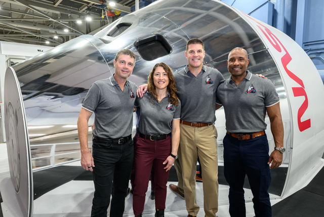 <p>The four Nasa astronauts of the Artemis II crew pose in front of an Orion simulator on 23 January at the Johnson Space Center in Houston, Texas</p>