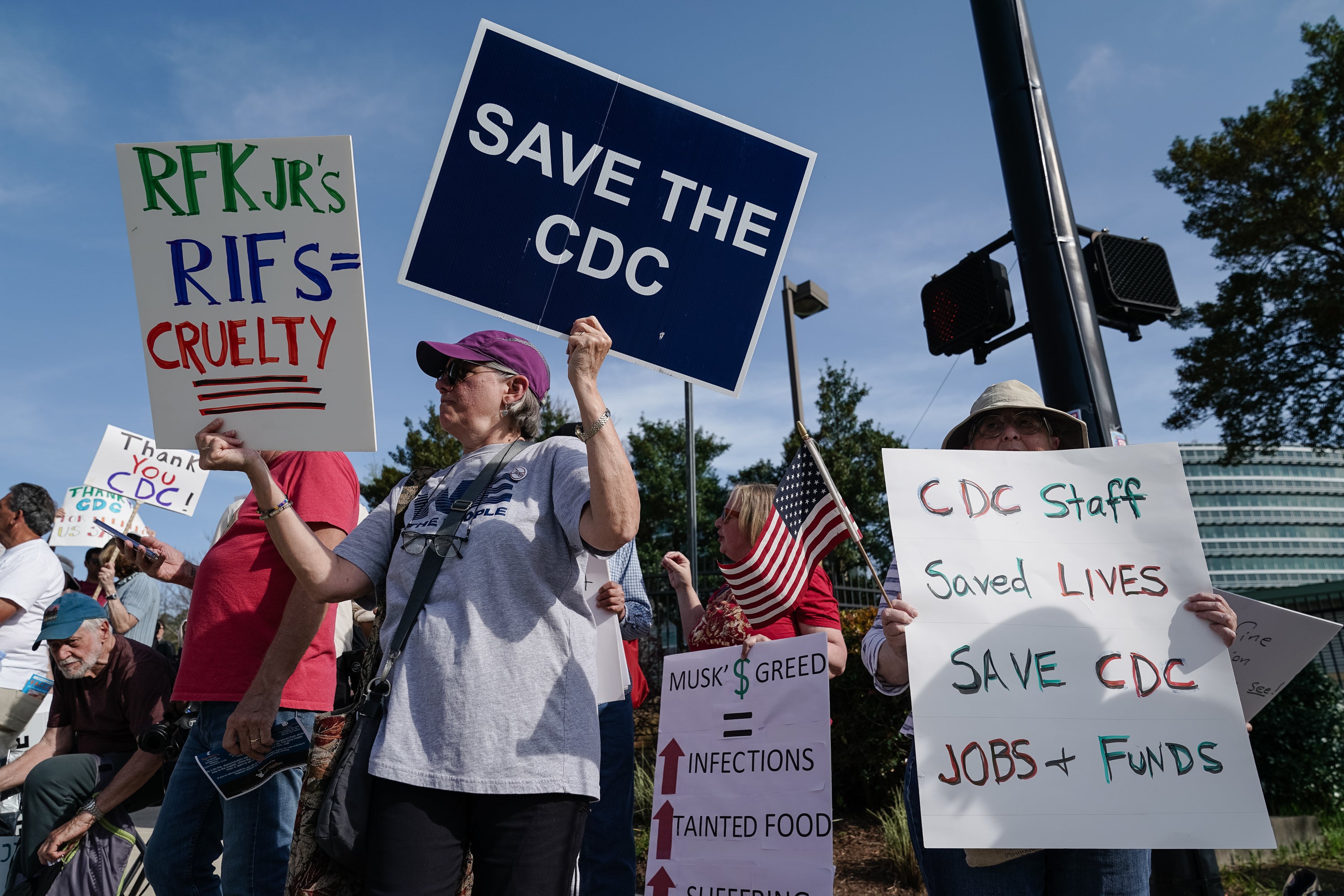 People demonstrate outside the main campus of the Centers For Disease Control and Prevention in Atlanta, Georgia, in April 2025. Researchers say an audit shows nearly half of the agency’s federal health surveillance databases had unexplained pauses in updates starting under Secretary Robert F. Kennedy, Jr.